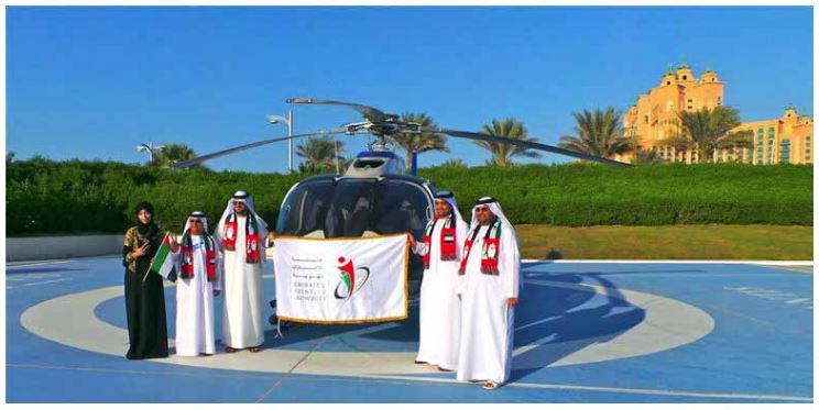 Employees from Emirates ID fly in Dubai’s skies carrying “Expo 2020” Logo