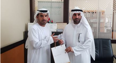 Employees of Ras Al Khaimah Customer Happiness Center participate in “One Million signatures of Loyalty to the Homeland” Campaign