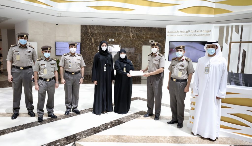 GDRFA – Um Al Quwain Honoured an Employee for her Outstanding Efforts